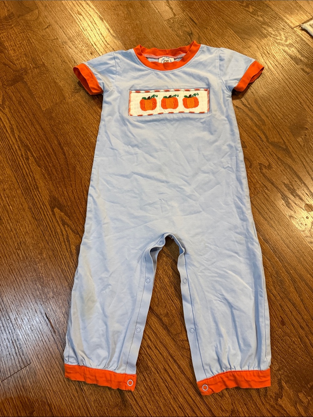 Light Blue Baby One-Piece with Orange Trim and Pumpkin Motif